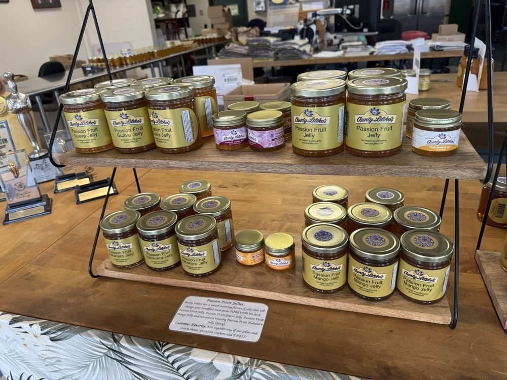 Shelves of Aunty Lilikoʻi passion fruit jellies in the Waimea store